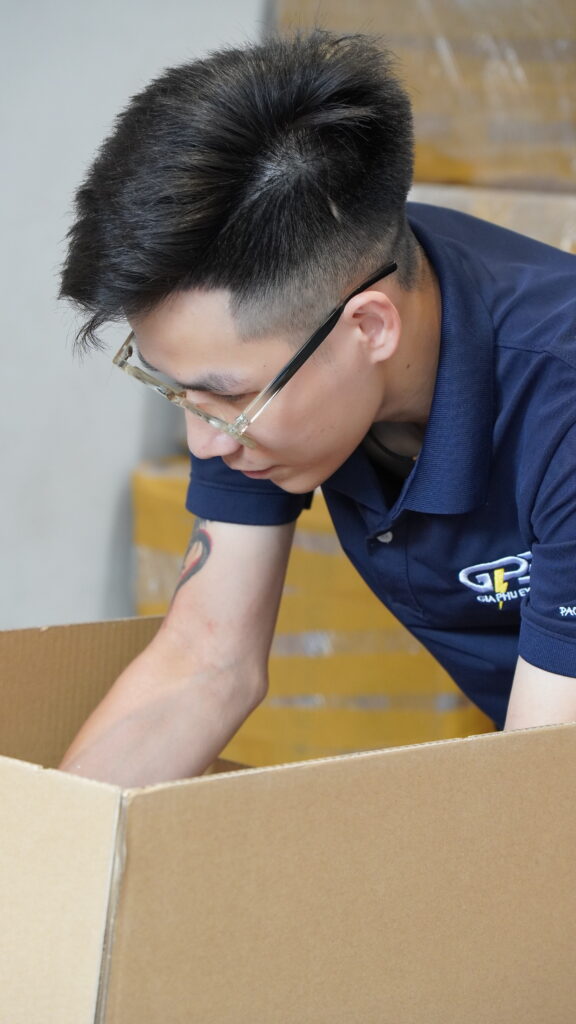 Gia Phu staff inspecting the contents of a carton